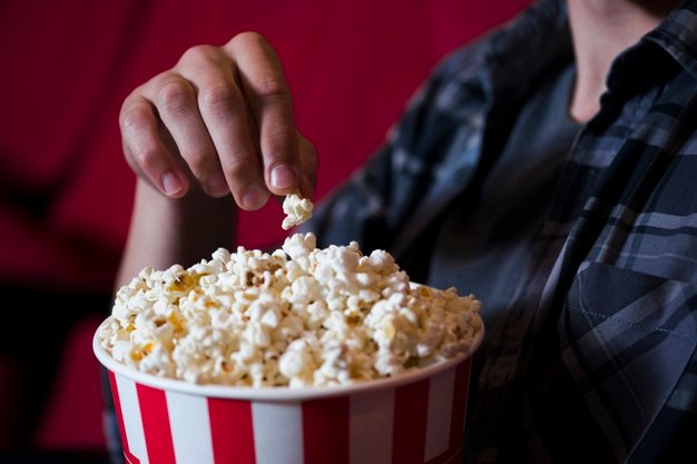 man eating popcorn cinema 23 2148202098